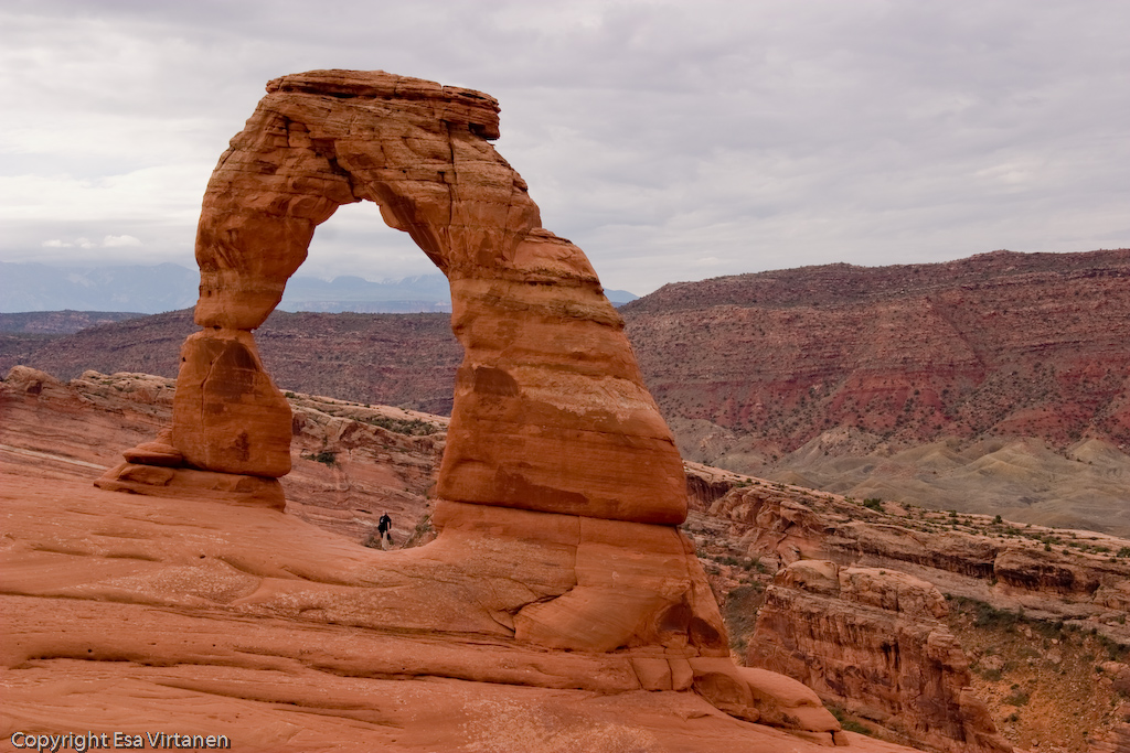 A delicate man and Delicate Arch, Arches National Park.